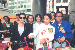 Famous local artists Miss Carina LAU, Ms Cecilia YIP and Mr Eddie KWAN distributed condom key chains to promote AIDS prevention at the Kick-off Ceremony of "1999 World AIDS Campaign".
